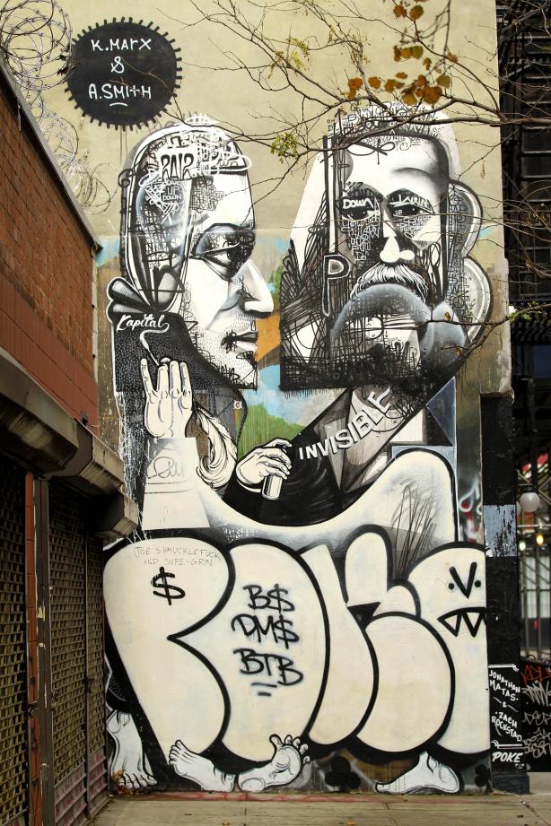 General views of Seattle-based grafitti artists Jonathan Matas and Zach Rockstad's mural called "Up and Down" depicting Karl Marx and Adam Smith located on Mott Street just north of Houston Street in